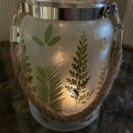 Green garden lantern with hemp rope
